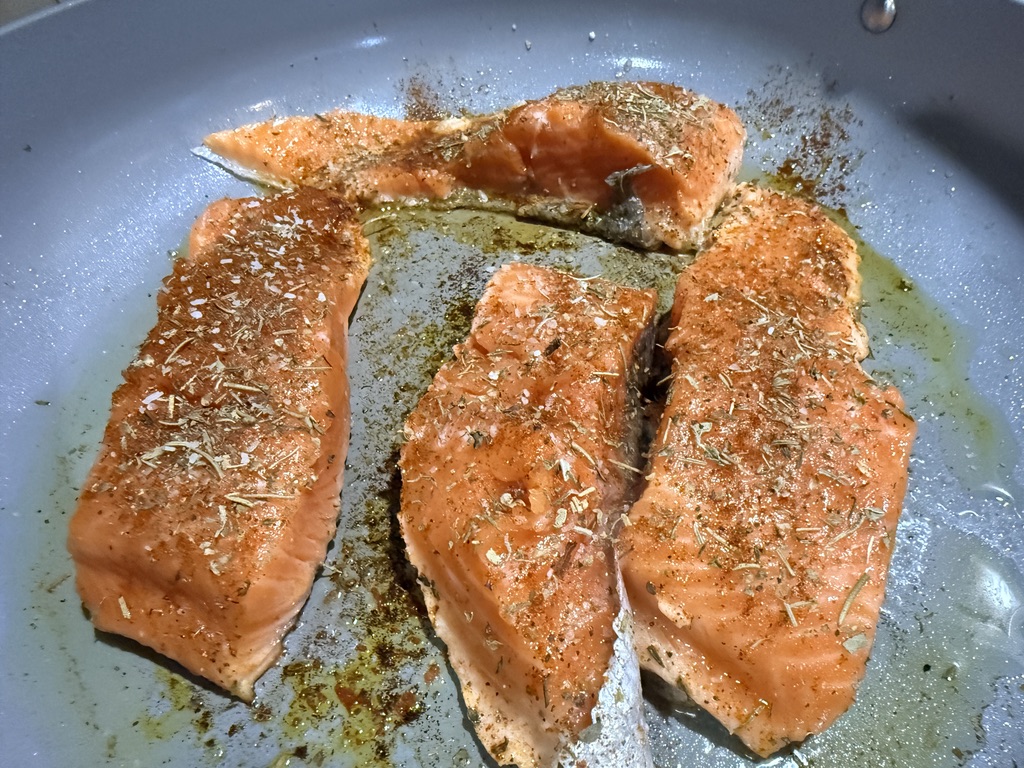 salmon cooking on stove top